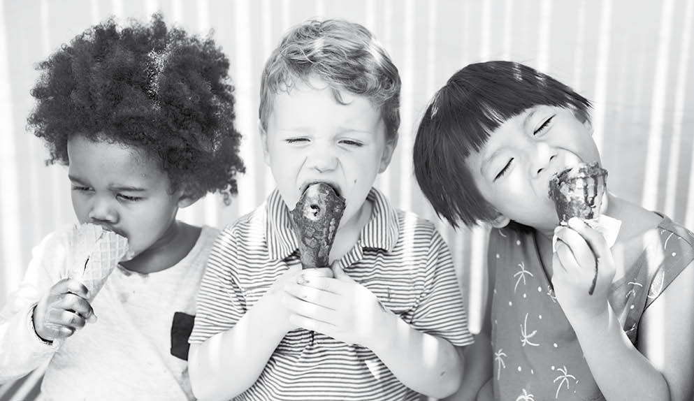 Children enjoying ice cream on a summer day